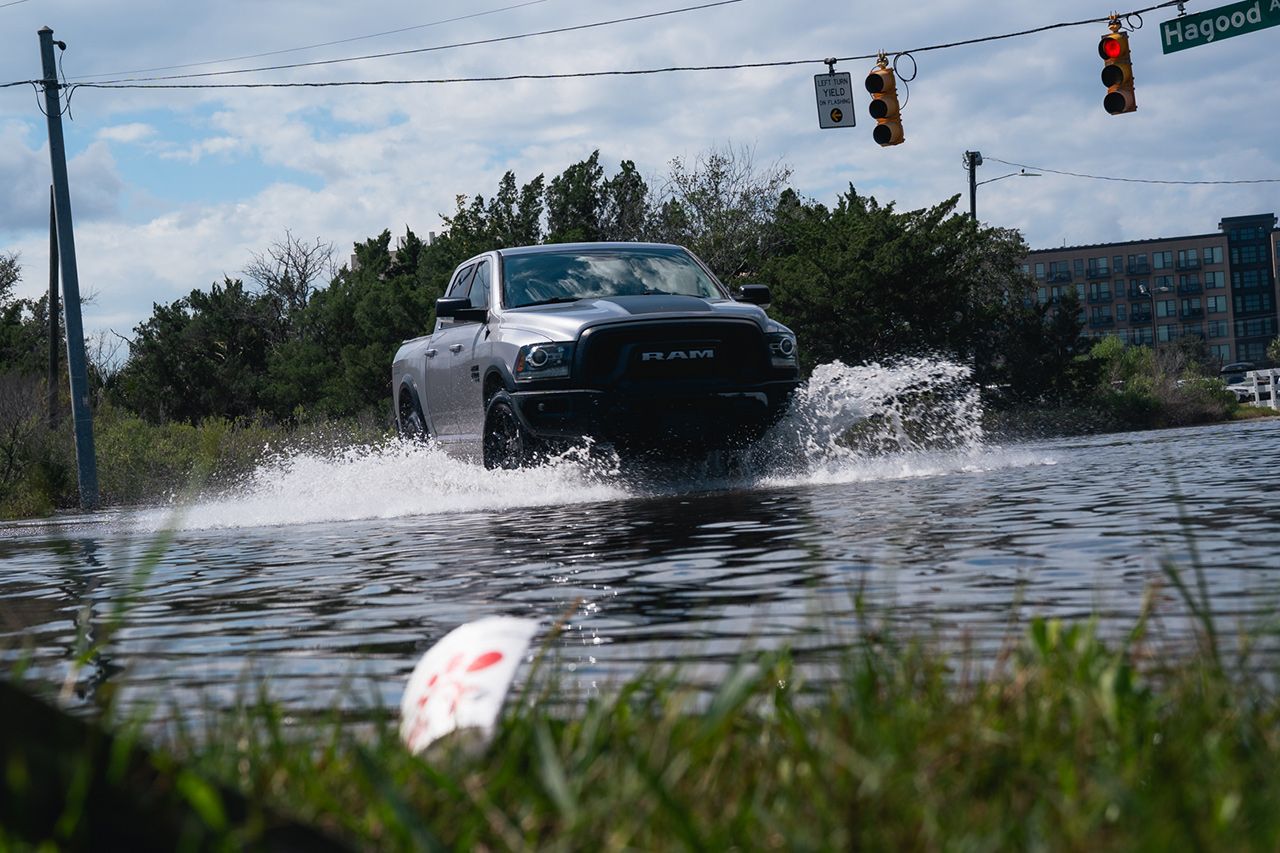 A truck drives through flood waters on Hagood Avenue in Charleston, SC